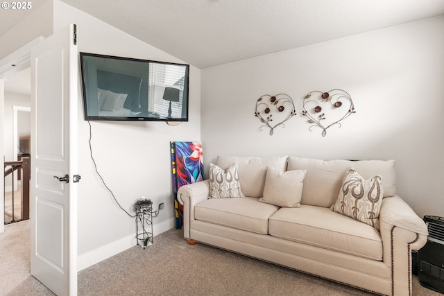 carpeted living room with vaulted ceiling and a textured ceiling