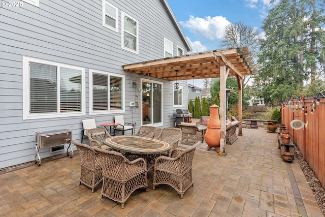 view of patio / terrace with area for grilling and an outdoor fire pit