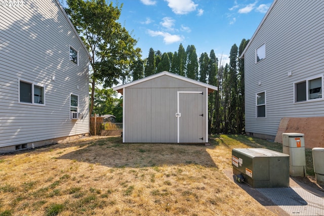 view of outdoor structure featuring a lawn