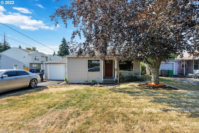 view of front of home featuring a garage and a front lawn