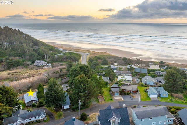 aerial view featuring a residential view, a water view, and a beach view