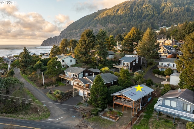 aerial view featuring a water and mountain view