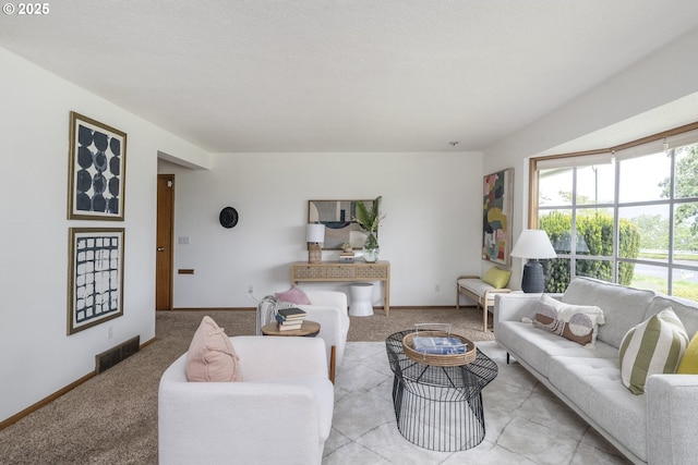 living area with light carpet and baseboards