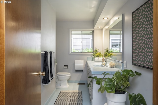 bathroom featuring toilet, baseboards, recessed lighting, tile patterned floors, and vanity