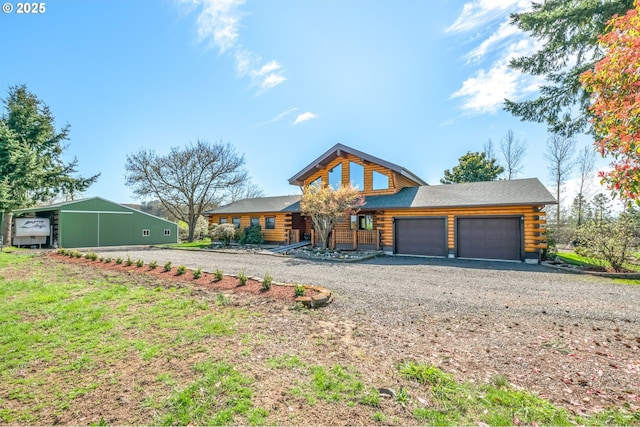 95787 Territorial Hwy, Monroe, OR 97456 - cabin featuring log exterior, dirt driveway, and an attached garage