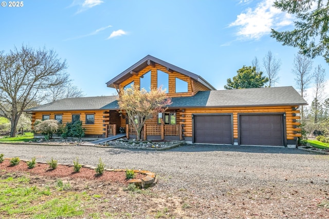 95787 Territorial Hwy, Monroe, OR 97456 - log cabin with driveway, log siding, an attached garage, and covered porch