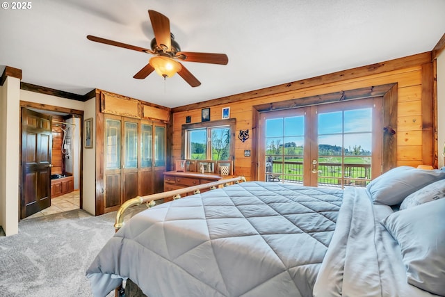 95787 Territorial Hwy, Monroe, OR 97456 - bedroom featuring access to outside, french doors, wood walls, light colored carpet, and ceiling fan