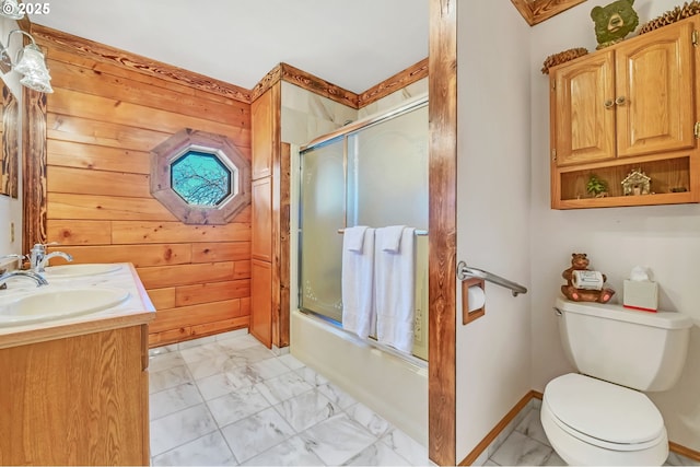 95787 Territorial Hwy, Monroe, OR 97456 - full bathroom featuring marble finish floors, combined bath / shower with glass door, toilet, wood walls, and double vanity