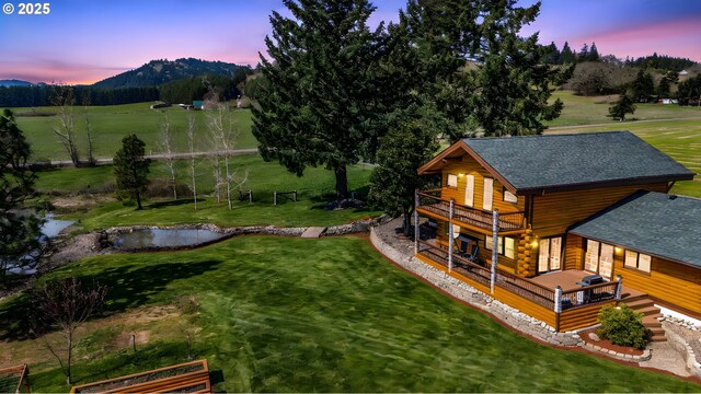 95787 Territorial Hwy, Monroe, OR 97456 - exterior space with a balcony, roof with shingles, a yard, log exterior, and a deck with water view