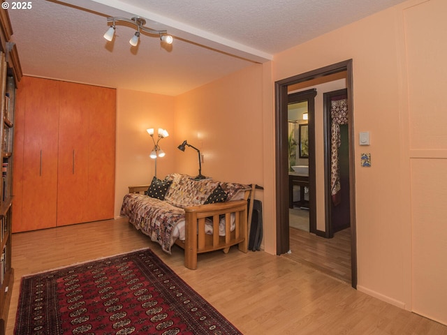 17758 SE Washington St, Portland, OR 97233 - bedroom featuring wood finished floors, a ceiling fan, and a textured ceiling