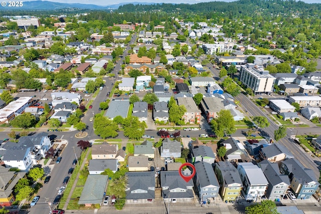 1733 Mill Aly, Eugene, OR 97401 - aerial overview of property's location featuring nearby suburban area and a mountain backdrop