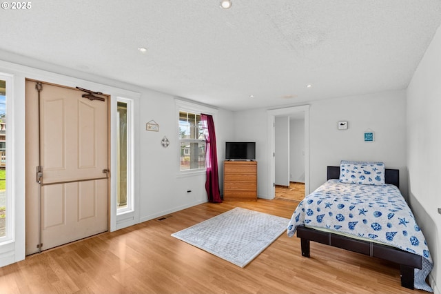 1000 S King St, Seaside, OR 97138 - bedroom with light wood-style floors, recessed lighting, and baseboards