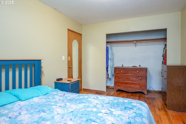 11102 SE 51st Ave, Milwaukie, OR 97222 - bedroom with hardwood / wood-style flooring and a closet