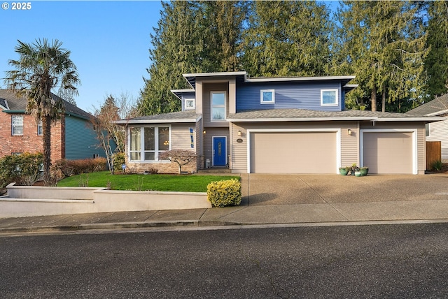 view of front facade with a garage and a front lawn