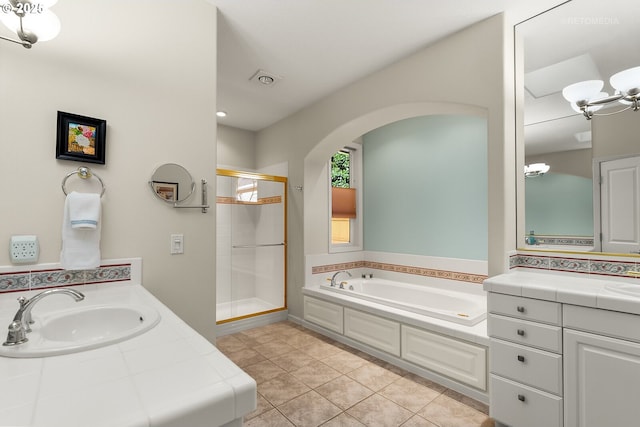 bathroom featuring vanity, separate shower and tub, and tile patterned floors