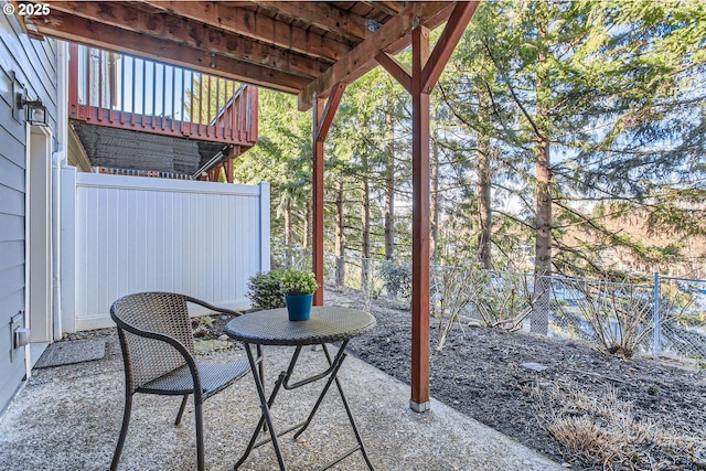 view of patio featuring fence