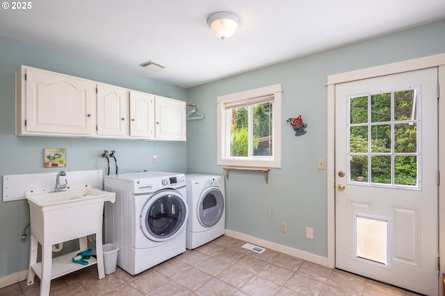 1444 Russet Dr, Eugene, OR 97401 - laundry area featuring cabinet space, washer and clothes dryer, and light tile patterned flooring