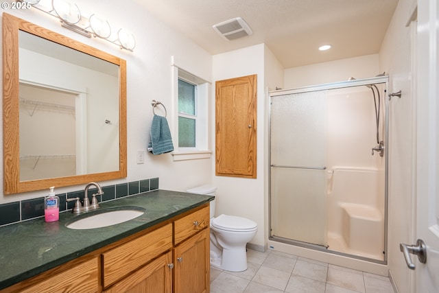1444 Russet Dr, Eugene, OR 97401 - bathroom featuring a stall shower, vanity, tile patterned flooring, a walk in closet, and recessed lighting