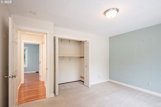1444 Russet Dr, Eugene, OR 97401 - unfurnished bedroom with a closet and light carpet