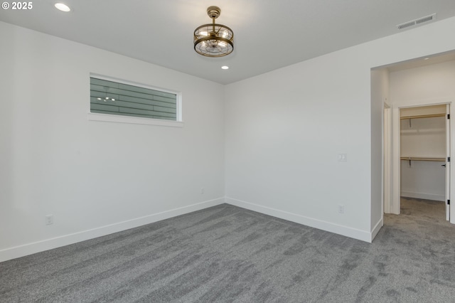 unfurnished bedroom featuring visible vents, recessed lighting, baseboards, and carpet floors
