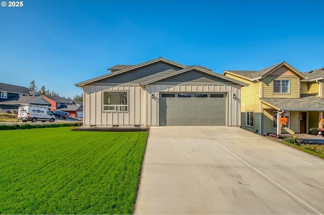 view of front of property with a garage, board and batten siding, driveway, and a front yard