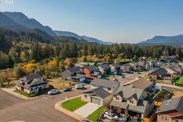 bird's eye view with a residential view, a wooded view, and a mountain view