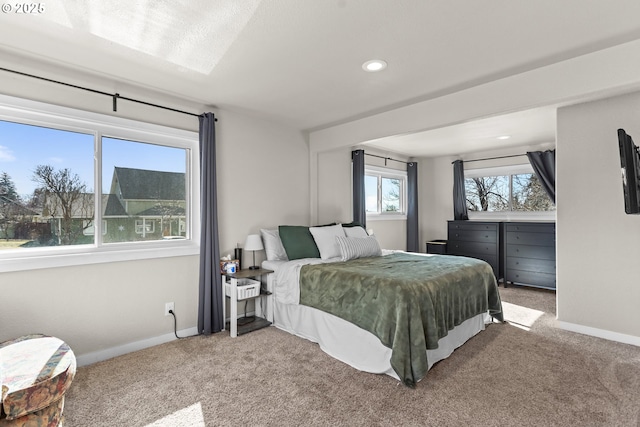 carpeted bedroom with recessed lighting and baseboards