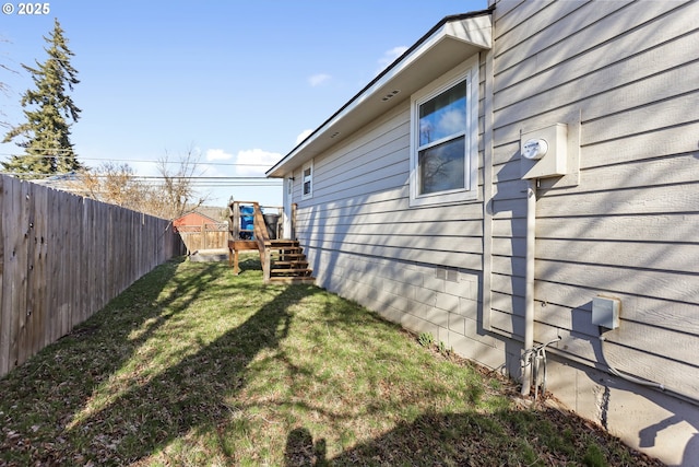 view of yard with a fenced backyard