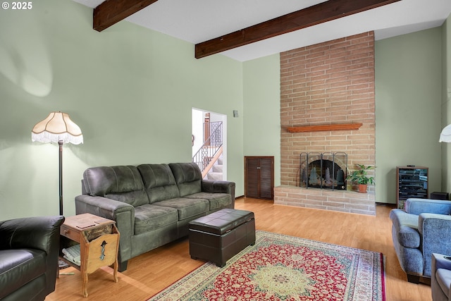 4420 NW 187th Ave, Portland, OR 97229 - living room featuring beam ceiling, wood finished floors, wine cooler, and a fireplace