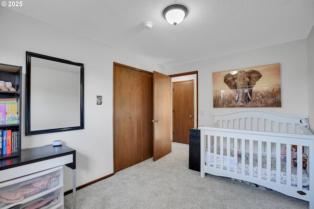 4420 NW 187th Ave, Portland, OR 97229 - bedroom featuring carpet flooring, a textured ceiling, and a closet