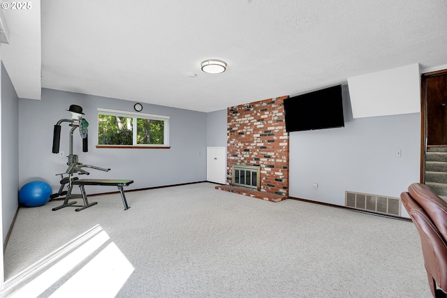 4420 NW 187th Ave, Portland, OR 97229 - exercise room with carpet flooring and a fireplace
