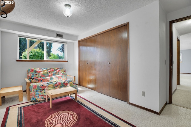 4420 NW 187th Ave, Portland, OR 97229 - living area featuring carpet flooring and a textured ceiling