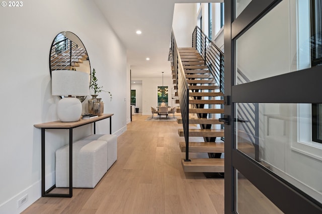 foyer with light hardwood / wood-style floors