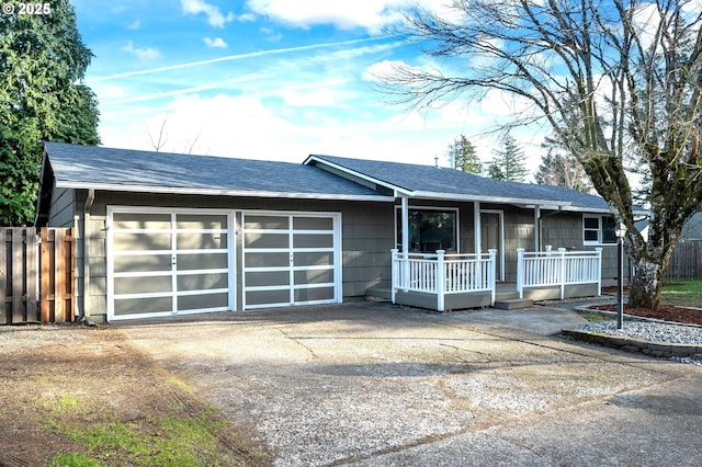 ranch-style house featuring a garage and a porch