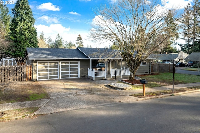 ranch-style home featuring a porch and a garage