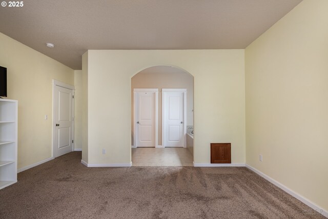 34511 Noble Rd, Saint Helens, OR 97051 - spare room with arched walkways, baseboards, and carpet floors