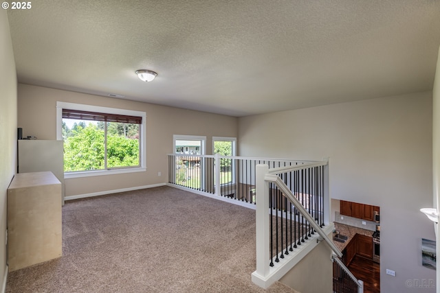 34511 Noble Rd, Saint Helens, OR 97051 - carpeted empty room featuring a textured ceiling and baseboards