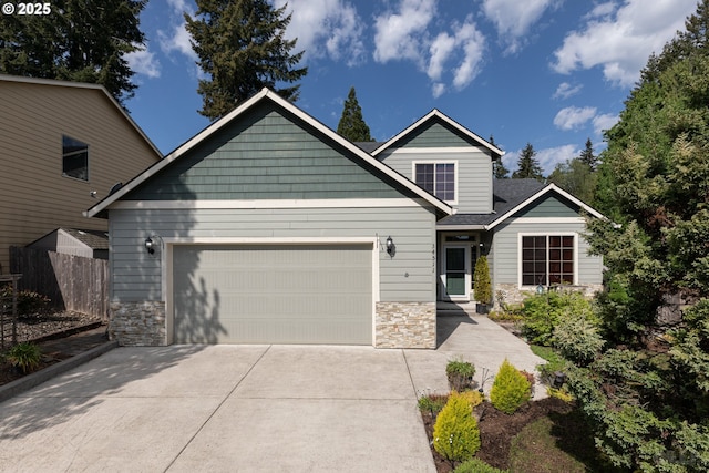 34511 Noble Rd, Saint Helens, OR 97051 - craftsman inspired home with stone siding, fence, driveway, and an attached garage