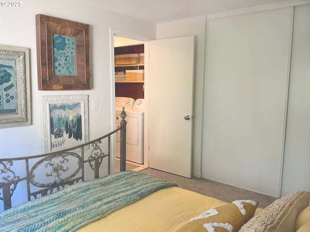 14922 SW 109th Ave, Portland, OR 97224 - bedroom with washing machine and dryer, carpet, and a closet