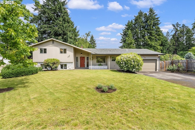 12370 SW 121st Ave, Tigard, OR 97223 - split level home featuring driveway, an attached garage, stone siding, and a chimney