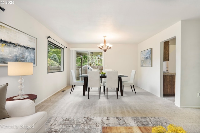 12370 SW 121st Ave, Tigard, OR 97223 - carpeted dining room with a chandelier and baseboards
