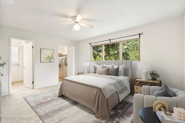 12370 SW 121st Ave, Tigard, OR 97223 - bedroom with a spacious closet, light carpet, connected bathroom, a closet, and ceiling fan