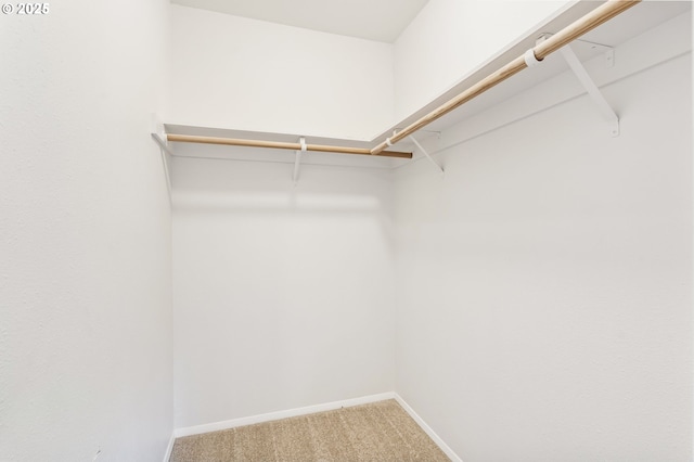 12370 SW 121st Ave, Tigard, OR 97223 - walk in closet featuring light colored carpet