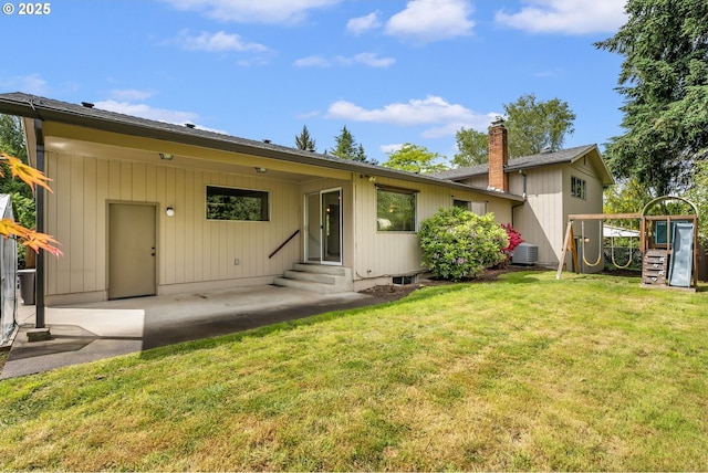 12370 SW 121st Ave, Tigard, OR 97223 - view of front facade featuring entry steps, a patio, a front yard, and central AC unit