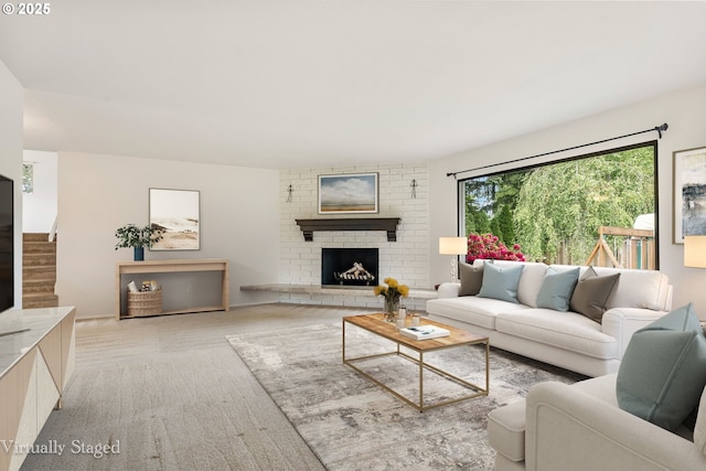 12370 SW 121st Ave, Tigard, OR 97223 - living area with a brick fireplace, stairway, and light colored carpet
