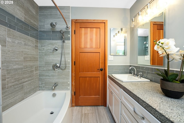 2634 SW Boundary St, Portland, OR 97239 - bathroom with vanity, bathing tub / shower combination, and tasteful backsplash
