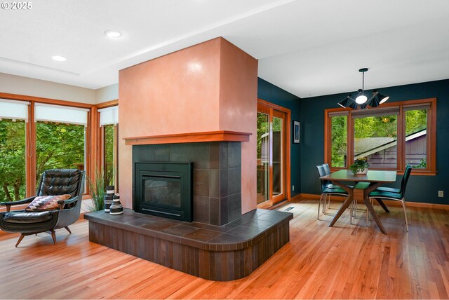 2634 SW Boundary St, Portland, OR 97239 - living room featuring wood finished floors, a tile fireplace, and recessed lighting