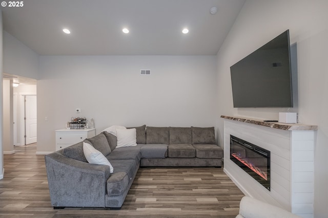 414 SE Ray St, Dallas, OR 97338 - living room featuring recessed lighting, a glass covered fireplace, visible vents, and wood finished floors