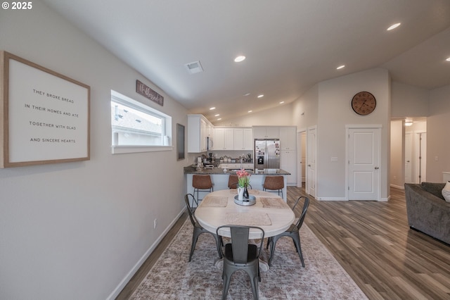 414 SE Ray St, Dallas, OR 97338 - dining room with visible vents, recessed lighting, vaulted ceiling, dark wood finished floors, and baseboards
