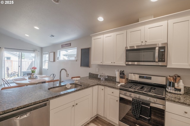 414 SE Ray St, Dallas, OR 97338 - kitchen featuring visible vents, white cabinets, appliances with stainless steel finishes, and a sink